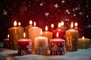 Burning candle and Christmas decoration over snow and wooden background. . photo