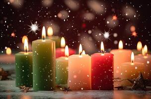 Burning candle and Christmas decoration over snow and wooden background. . photo