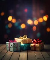 Christmas presents wrapped in red paper with gold ribbon on on wooden table background and bokeh. Place for typography and logo. Copy space. . photo