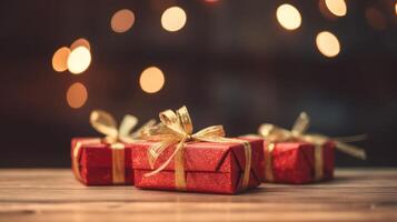 Christmas presents wrapped in red paper with gold ribbon on on wooden table background and bokeh. Place for typography and logo. Copy space. . photo