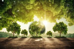 Glass globe on wood table in nature concept for environment and conservation. Ecology and Environment concept. . photo