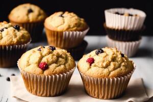 Homemade muffins with cinnamon and almonds on a black background. photo