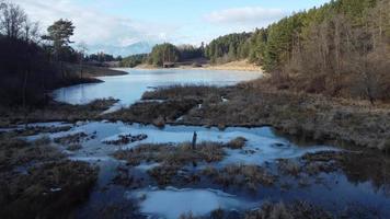 Peaceful mountain scene with calm lake. Scenic view of High Tatras National Park, Slovakia. photo