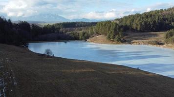 Peaceful mountain scene with calm lake. Scenic view of High Tatras National Park, Slovakia. photo