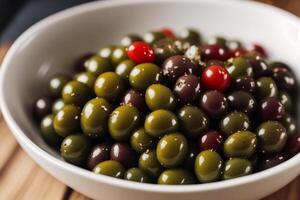 Fresh salad with green olives, feta cheese and cherry tomatoes in a bowl. Healthy salad. photo