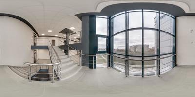full spherical hdri 360 panorama view in empty modern hall near panoramic windows with columns, staircase and doors in equirectangular projection, ready for AR VR content photo