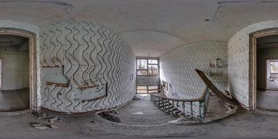 full hdri 360 panorama in empty dirty room in abandoned building damaged by explosion in entrance with old staircase in spherical equirectangular projection, ready AR VR virtual reality content photo