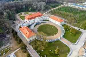 aerial view on overlooking restoration of the historic castle or palace near lake photo