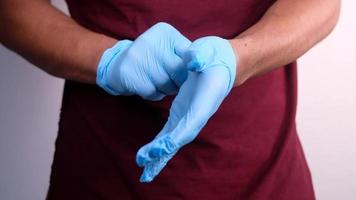 doctor wears medical latex gloves isolated on white video