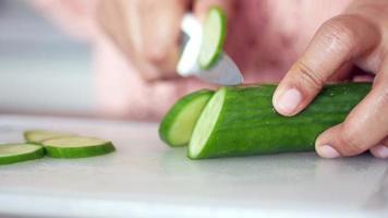 close up of slice of cucumber in a bowl on table video