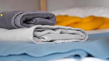 Close up of stack of shower towel on table. video