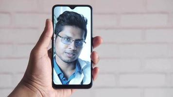 Taking online consultation with doctor on smart phone video