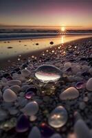 glass ball sitting on top of a beach next to the ocean. . photo