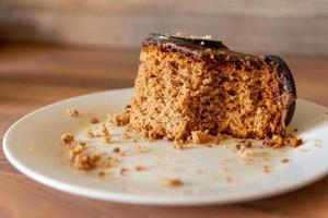 a eaten piece of cake on a plate photo