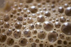 background of beige coffee foam in closeup photo