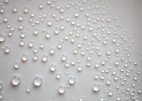 small fine round droplets on a white background photo