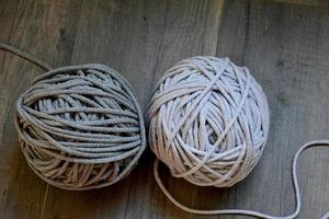 grey handmade cottoncord tablecloths on crochet hook photo