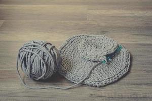 grey handmade cottoncord tablecloths on crochet hook photo