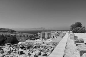 old antique stone ruins on a hot summer day on the Greek island of Rhodes in Lindos photo