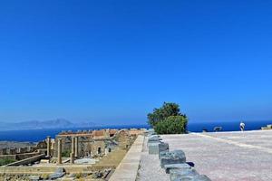 old antique stone ruins on a hot summer day on the Greek island of Rhodes in Lindos photo