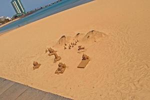 original sand structures on the beach on a beautiful warm sunny day by the ocean photo