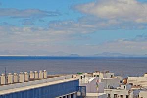 scenery with the city's characteristic white buildings from the Spanish island of Lanzarote on a warm summer day photo