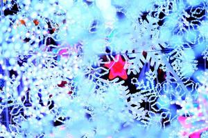 Red star in Glamour white sparkling with glitter bokeh of metallic white pine snow tree. Multicolored Christmas and New Year glowing light abstract for Christmas and holiday concept. photo