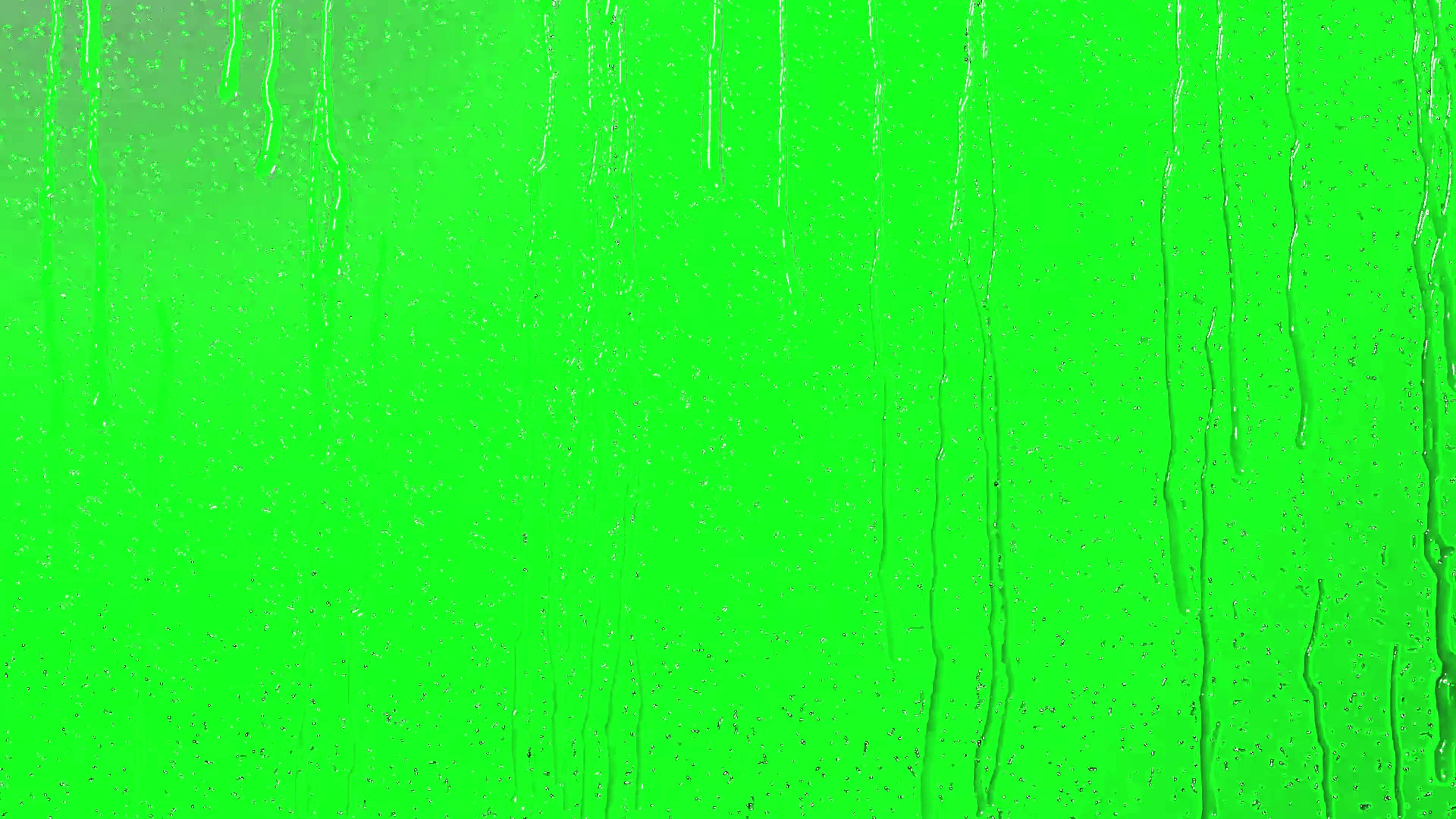 Realistic 3d rain fall effect on glass with green background. Rain