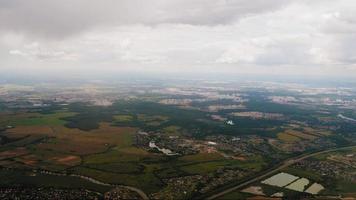 The plane flies over the city of Moscow, view from the window video