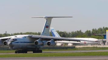 NOVOSIBIRSK, RUSSIAN FEDERATION JUNY 12, 2022 - Footage of transport aircraft IL 76 taxiing on runway at Tolmachevo airport. Il 76 Soviet heavy military transport aircraft video