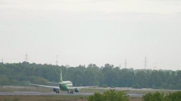 NOVOSIBIRSK, RUSSIAN FEDERATION JULY 15, 2022 - Airbus A320 of S7 Airlines acceleration and takeoff at Tolmachevo airport. Tourism and travel concept video