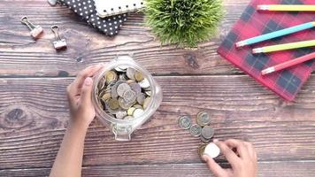 Child girl pile coin for saving video