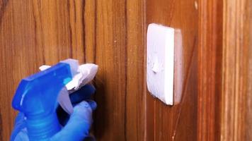 clean and disinfect light switch, close up video