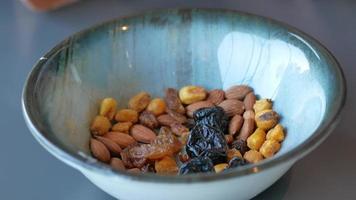 hand pick many mixed nuts video