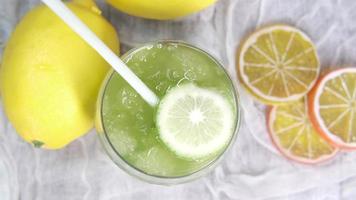 Top view of fresh lime juice on table video