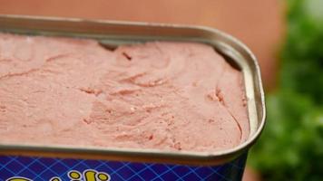 close up of canned meat on table video