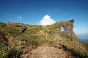 Beautiful landscape valley of mountain and blue sky in winter at Phu Chee Fah hill northern of Thailand photo