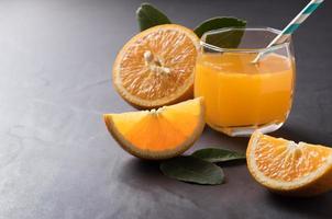 Fresh sliced orange and orange juice photo