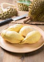 fresh durian on wood dish, king of fruit photo
