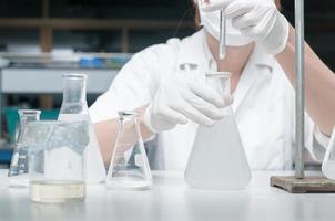 Scientist working in laboratory, testing samples photo