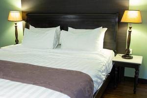 Bedroom Interior with Pillow and Table Lamp photo