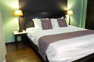 Bedroom Interior with Pillow and Table Lamp photo