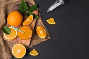 Fresh sliced orange and orange juice photo