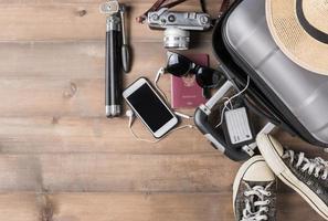Travel accessories costumes. Passports, luggage, camera, sunglasses, sneaker photo
