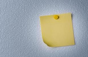 Yellow POST-IT NOTES on foam plate photo