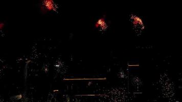 Festive beautiful fireworks in the night sky. Celebration Event, night city background. Concept New Year and Christmas. Beautiful bright big salute video