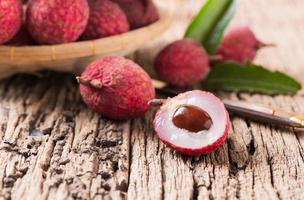 fresh organic lychee fruit on wood photo