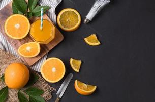 Fresh sliced orange and orange juice photo