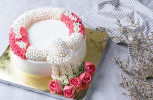 whipping cream cake decoration as a jasmine garland photo