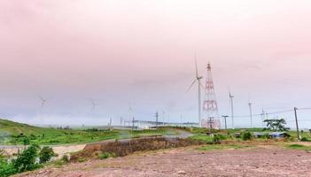 wind turbine with fog in rainny season photo